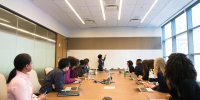Business meeting with diverse team discussing projects in a modern conference room.